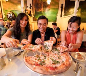 Sharing pizza on the best food tour in San Francisco: Stretchy Pants food tours