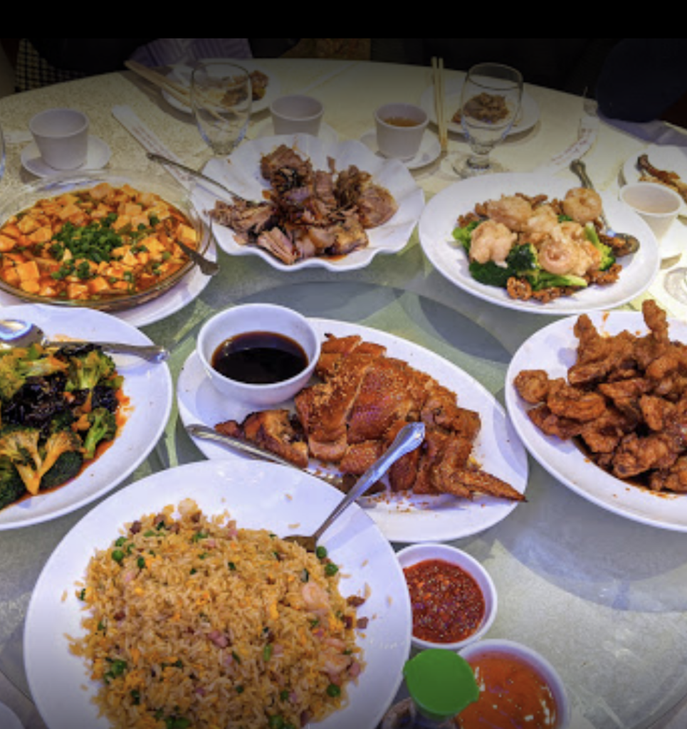 A table of plates of dim sum in NYC.