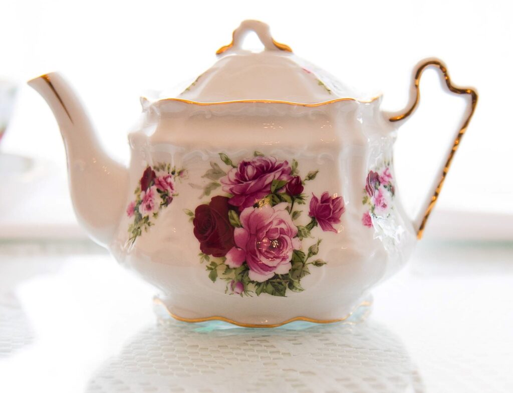Delicate porcelin tea pot to go with brunch of tea sandwiches, petit fours, and scones with clotted cream at Sip Tea Room.
