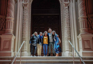 Team building San Francisco: small group posing on ornate steps of a historic San Francisco landmark during a Stretchy Pants team-building event.